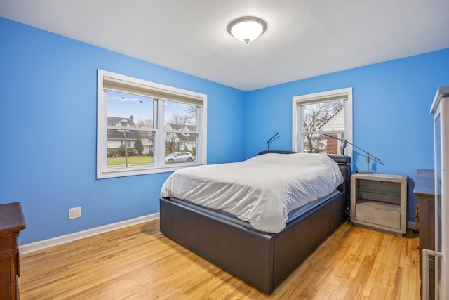 bedroom with light wood-type flooring