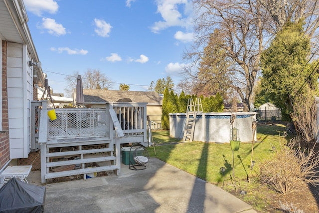 view of yard featuring a swimming pool side deck