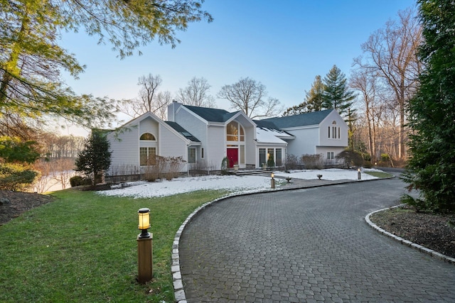 view of front of property with a yard