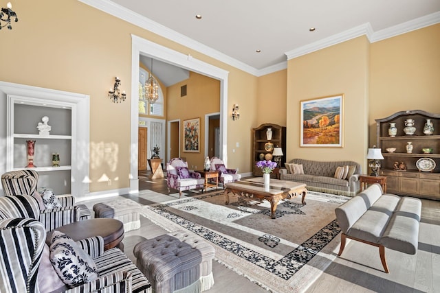 living room featuring crown molding and a chandelier