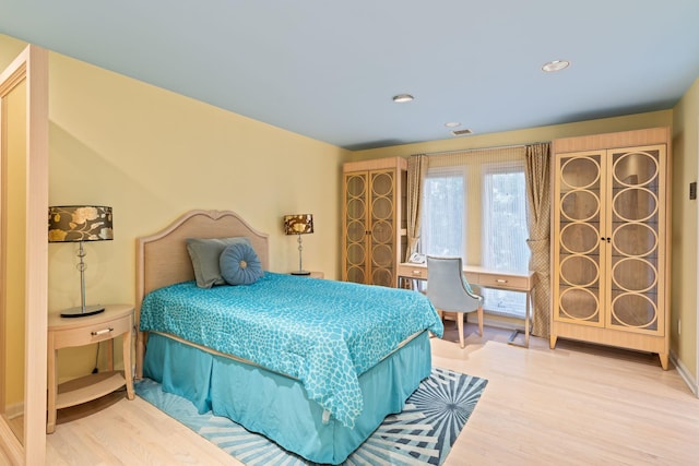 bedroom featuring wood-type flooring