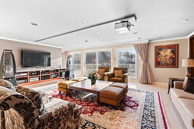 living room with light wood-type flooring and crown molding