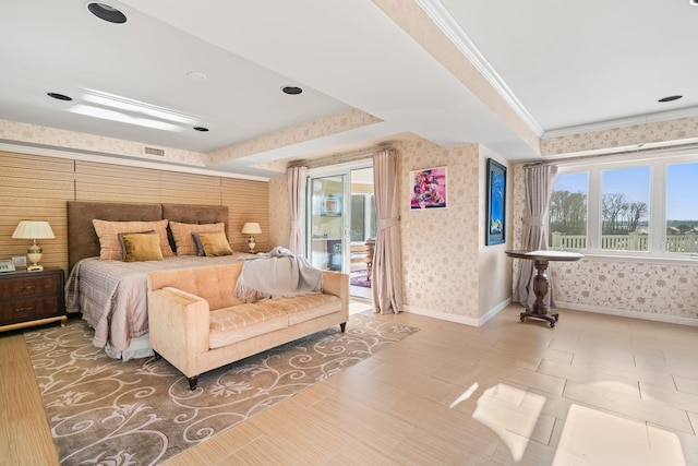 bedroom featuring a raised ceiling and ornamental molding