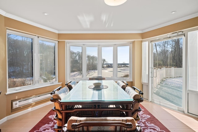 sunroom / solarium featuring a baseboard heating unit