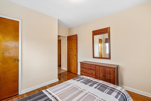 bedroom with hardwood / wood-style flooring