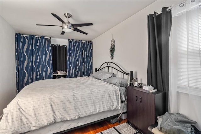 bedroom featuring hardwood / wood-style floors and ceiling fan