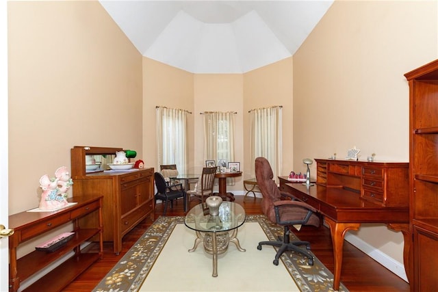 office space with wood-type flooring and vaulted ceiling