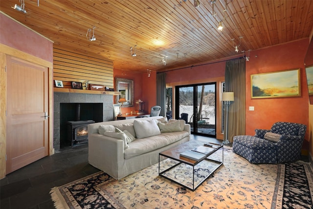 living area with rail lighting, wood ceiling, and french doors