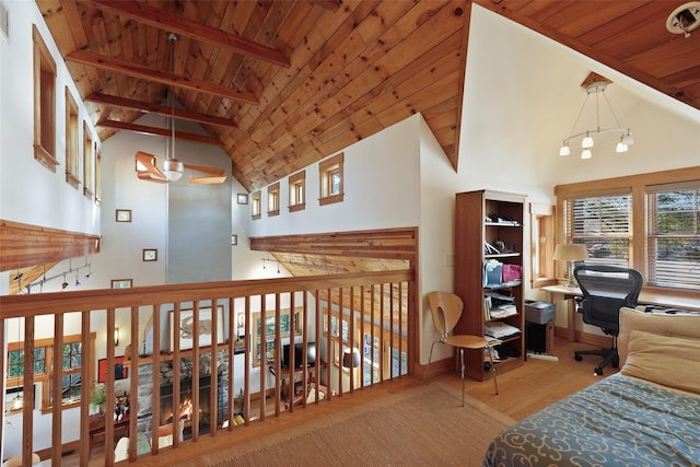 bedroom with high vaulted ceiling, beamed ceiling, wooden ceiling, and wood finished floors