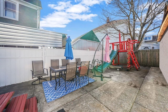 view of patio featuring a playground