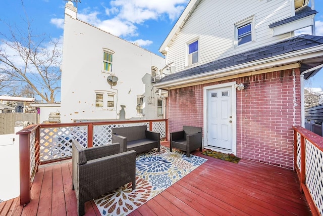 wooden deck with an outdoor hangout area