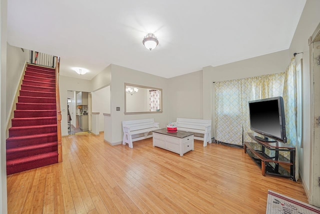 interior space featuring light hardwood / wood-style floors and a notable chandelier