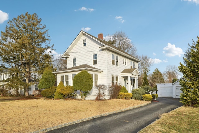 front of property with an outbuilding and a garage