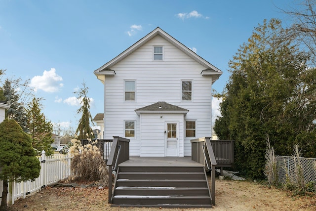 back of house with a wooden deck