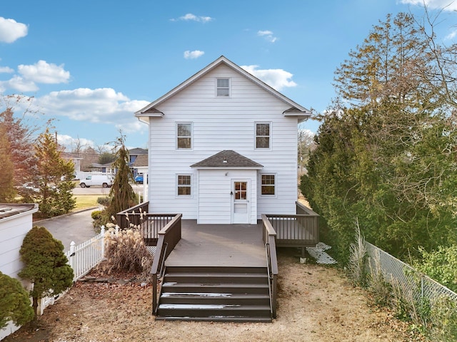 back of property featuring a deck