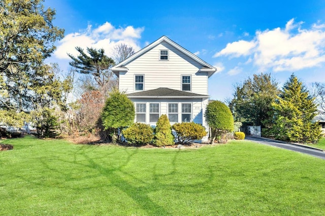 view of side of property featuring a yard