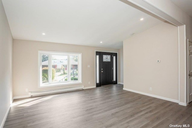 entrance foyer with dark hardwood / wood-style flooring and a baseboard radiator