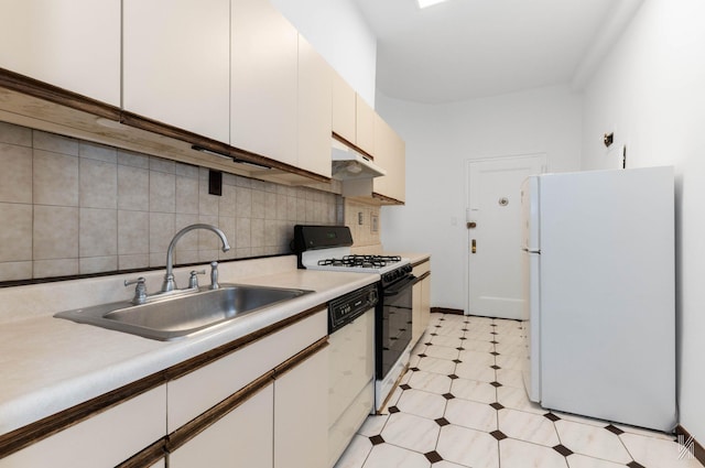 kitchen featuring white cabinets, white appliances, tasteful backsplash, and sink