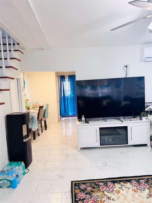 living room with ceiling fan and a wall unit AC