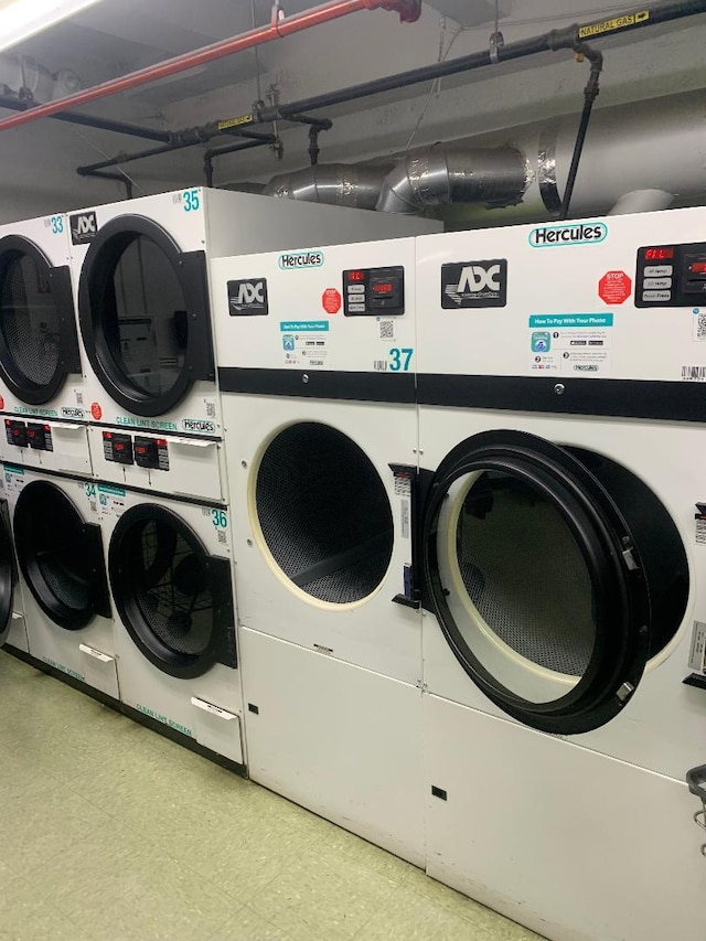 clothes washing area featuring stacked washer / drying machine and independent washer and dryer