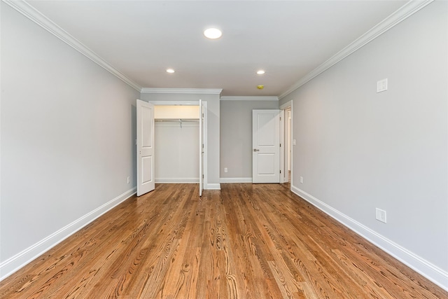 unfurnished bedroom featuring light hardwood / wood-style flooring and ornamental molding