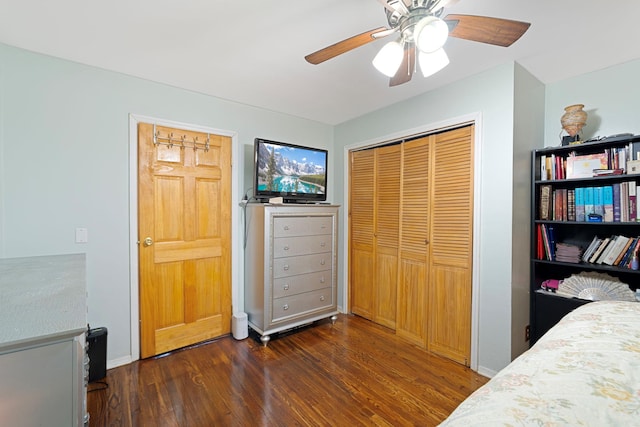 bedroom with ceiling fan, dark hardwood / wood-style flooring, and a closet