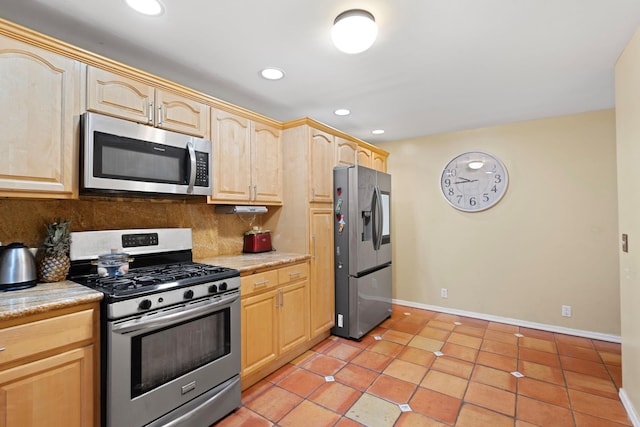 kitchen with decorative backsplash, light brown cabinets, light tile patterned flooring, and appliances with stainless steel finishes