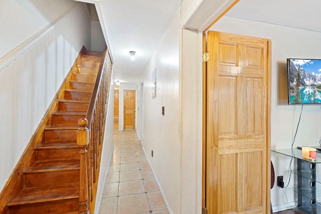 staircase featuring tile patterned floors