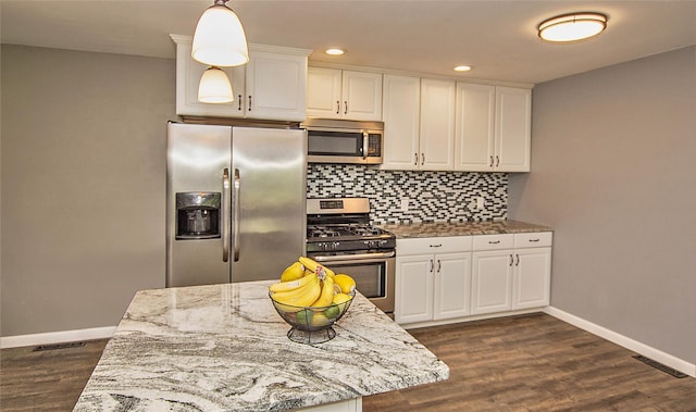8 Maple Dr, Warwick, NY 10990 - kitchen featuring stainless steel appliances, tasteful backsplash, white cabinets, light stone countertops, and recessed lighting