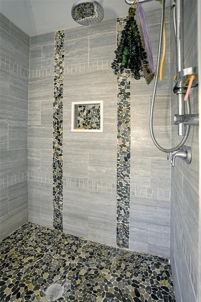 8 Maple Dr, Warwick, NY 10990 - bathroom featuring a tile shower and stone finish floors