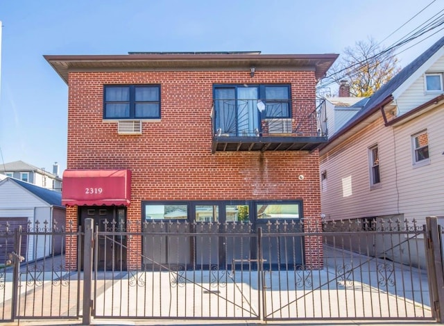 view of front of property with a balcony