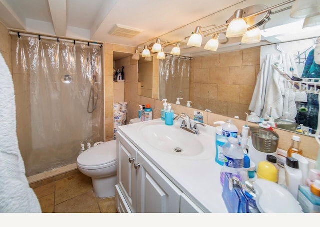 bathroom with walk in shower, tile patterned flooring, toilet, vanity, and tile walls