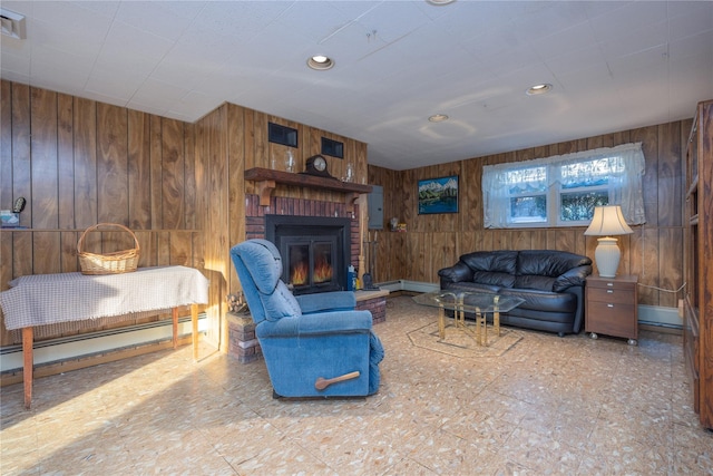 living room with wooden walls, a fireplace, and baseboard heating