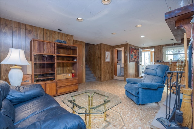 living room featuring wooden walls