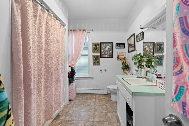 bathroom featuring vanity, a baseboard radiator, and toilet