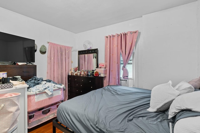 bedroom featuring wood-type flooring