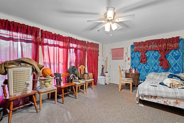 bedroom with ceiling fan and carpet floors