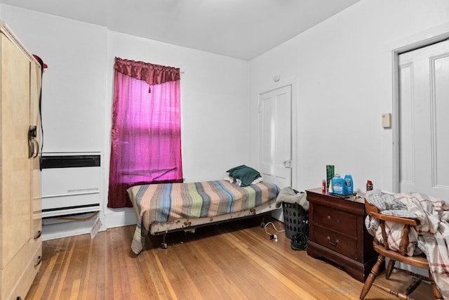 bedroom featuring wood-type flooring