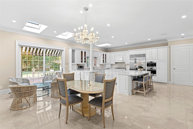 dining space with a notable chandelier, crown molding, and a skylight