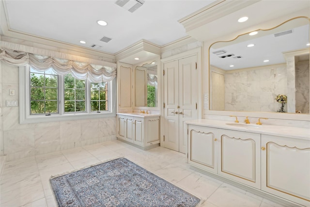 bathroom with vanity and crown molding