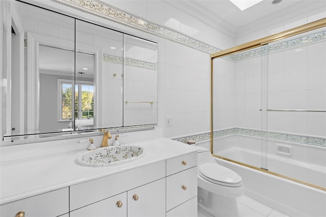 full bathroom featuring shower / bath combination with glass door, toilet, vanity, and ornamental molding