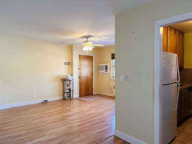 interior space with ceiling fan, white fridge, dishwasher, and light wood-type flooring