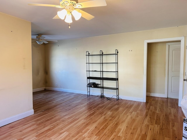 spare room with ceiling fan and light hardwood / wood-style flooring