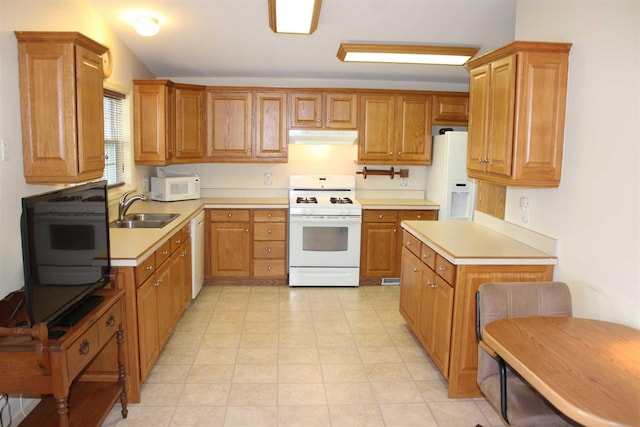 kitchen featuring sink and white appliances