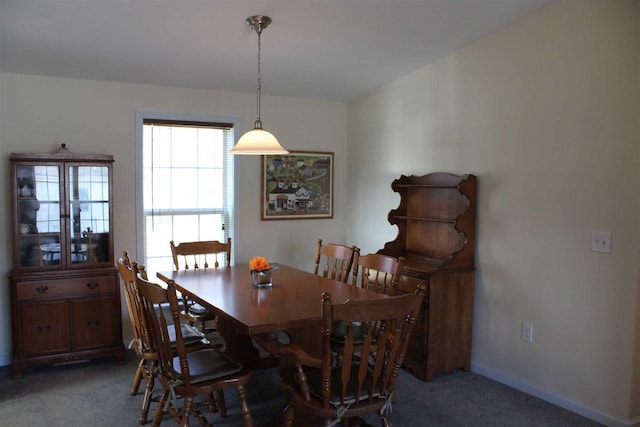 dining space featuring carpet flooring