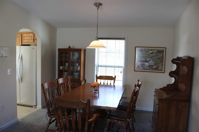 dining area with light carpet