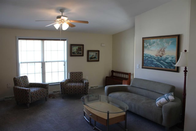 carpeted living room featuring ceiling fan