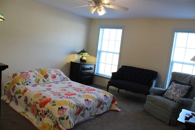 bedroom featuring dark colored carpet and ceiling fan