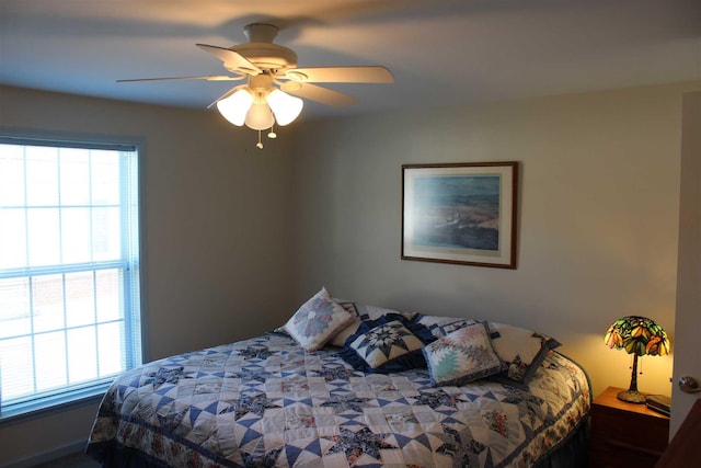 bedroom with multiple windows and ceiling fan