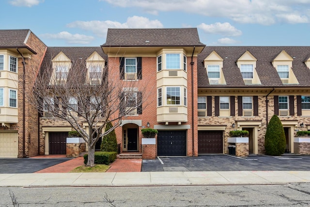 townhome / multi-family property with a garage